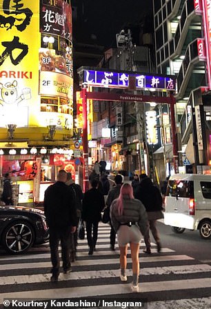 While crossing Shibuya Crossing, Kim could be seen wearing a pair of silver biker shorts and a form-fitted puffer jacket