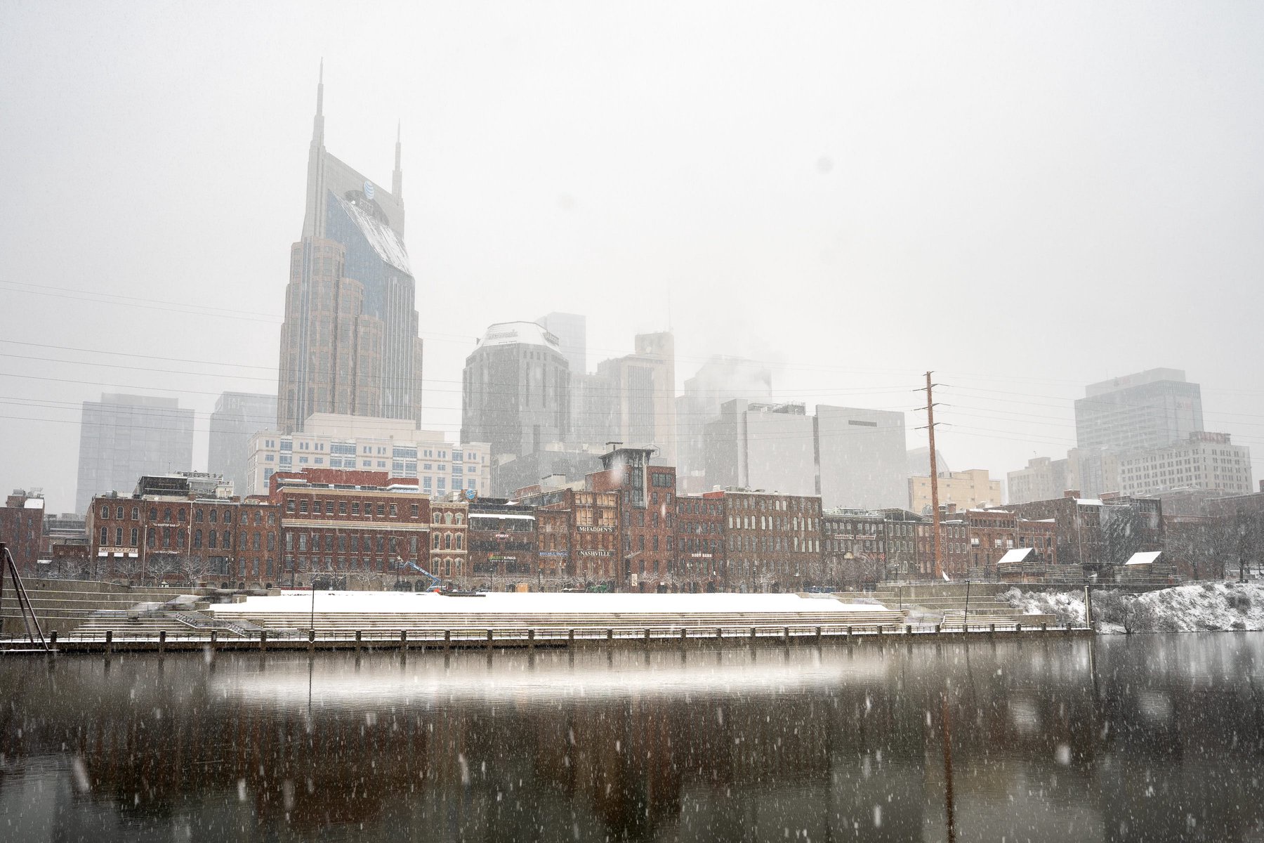 Snow falls on downtown Nashville, Tenn., Friday, Jan. 10, 2025.