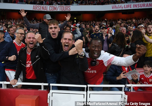 Arsenal fans celebrate during the Premier League match between Arsenal FC and Aston Villa at Emirates Stadium on September 22, 2019 in London, United Kingdom.