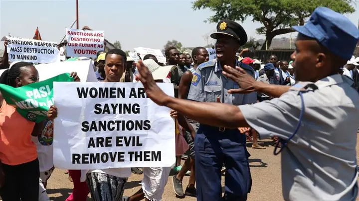 Thousands of Zimbabweans rallied on Friday in support of President Emmerson Mnangagwa's call on the US and the EU to lift sanctions on Zimbabwean leaders [Philimon Bulawayo/Reuters]