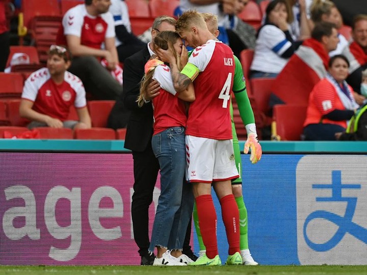 Simon Kjaer consoles Eriksen's distressed wife