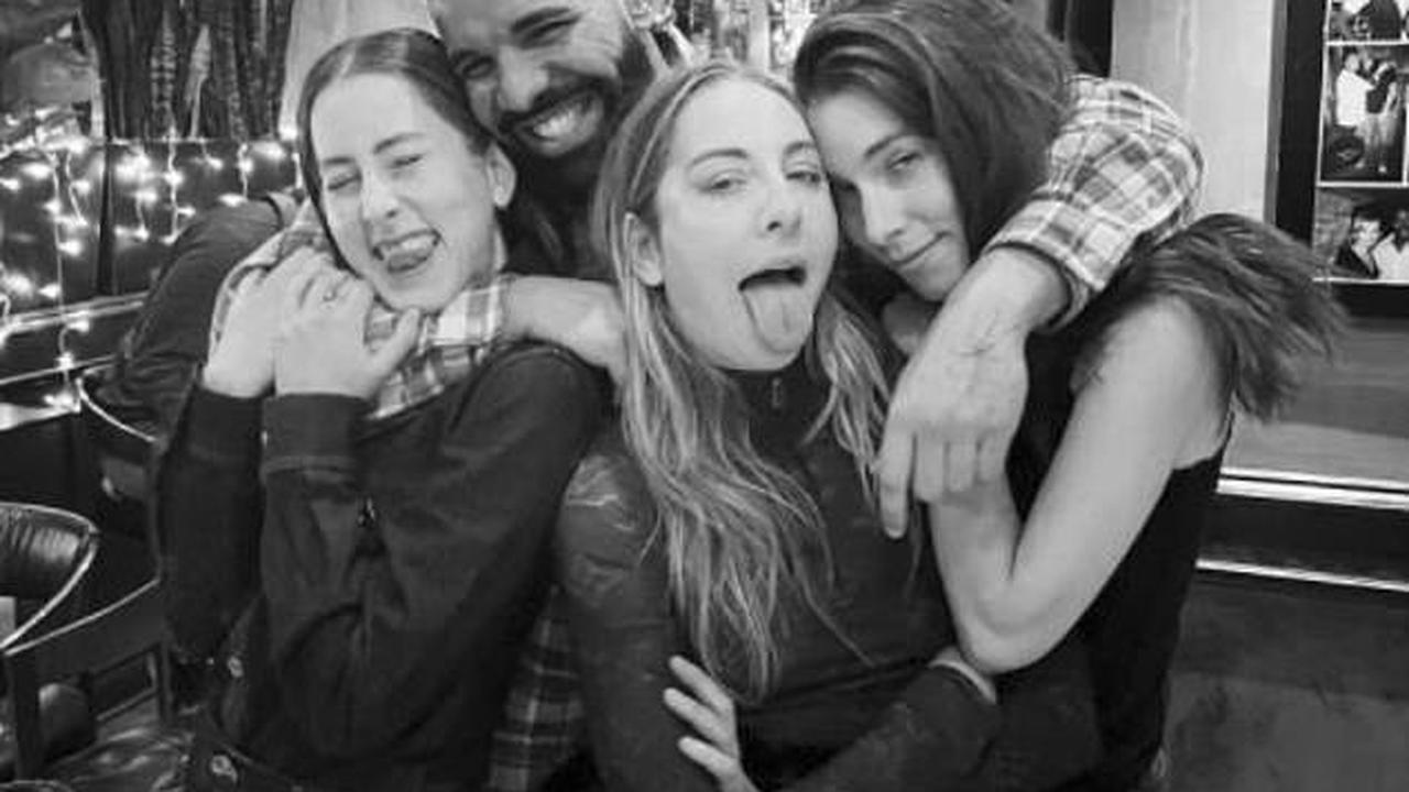 Drake cuddles up with sister band Haim in Instagram snap as he jokes he 'just met The Beatles'