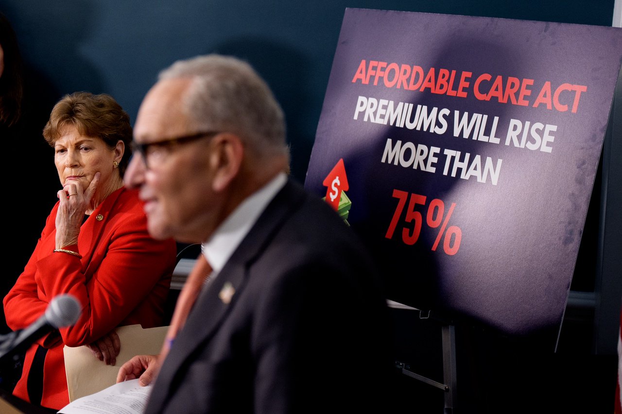 WASHINGTON, DC - SEPTEMBER 16: A poster reads "Affordable Care Act Premiums Will Rise More Than 75%" as Senate Minority Leader Chuck Schumer (D-NY) (2nd-L), accompanied by Sen. Jeanne Shaheen (D-NH) (L), speaks at a news conference to call on Republicans to pass Affordable Care Act tax breaks on Capitol Hill on September 16, 2025 in Washington, DC. Democratic Senators joined Protect Our Care and advocates to call on the GOP to protect health care for Americans and stop premium hikes. (Photo by Andrew Harnik/Getty Images)