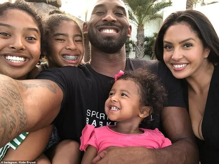 Kobe and his family meeting Minnie Mouse at Disneyland on a family day out just weeks before the basketball legend was killed in a helicopter crash with daughter Gianna, 13 (third left)
