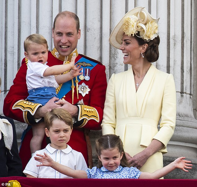 The Duke and Duchess of Cambridge with their children, Prince Louis, Prince George and Princess Charlotte, on the balcony of Buckingham Place as they watch the flypast following Trooping the Colour ceremony on 08 June 2019