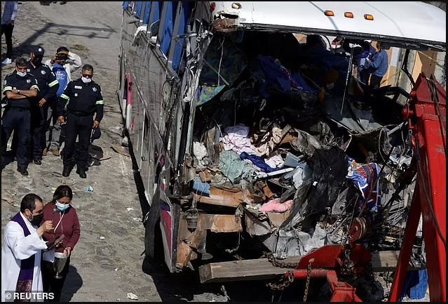 Nineteen people dead and 32 more injured after bus carrying Catholic pilgrims to religious site in Mexico crashed into a building (photos)