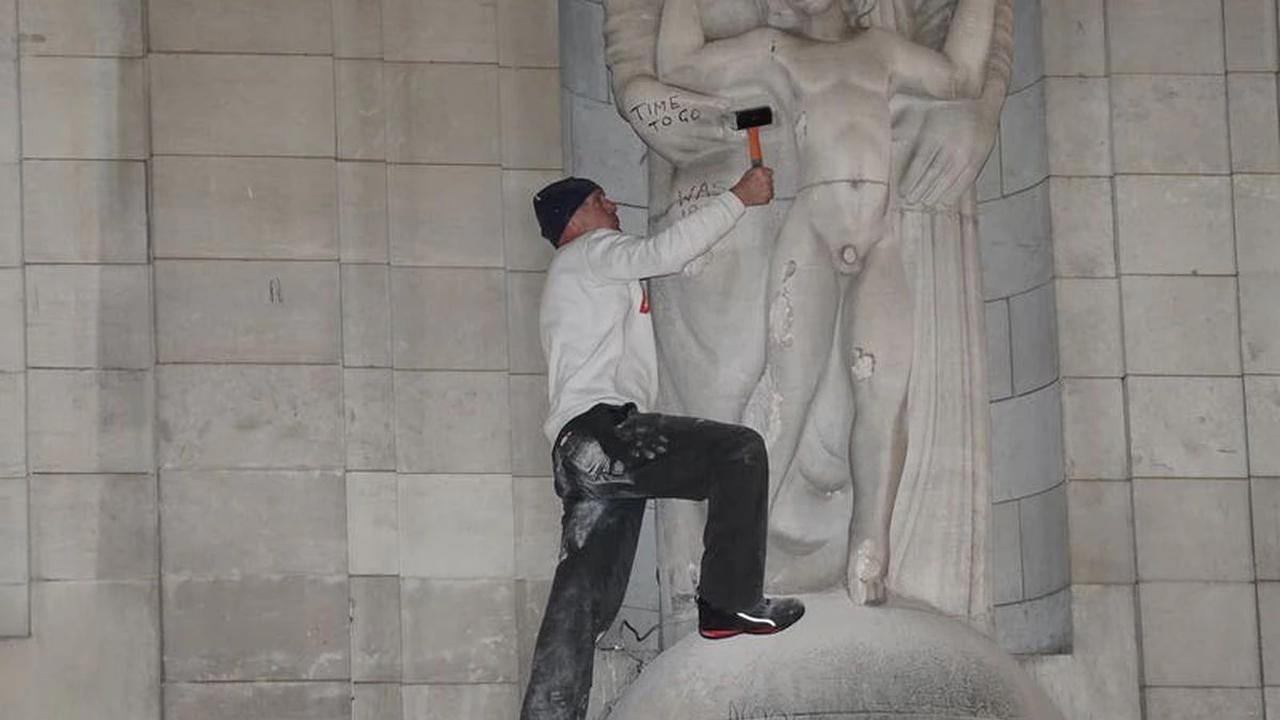 Man uses hammer on statue on BBC headquarters