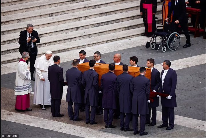 Pope Francis presides as Pope Benedict XVI is laid to rest (photos)