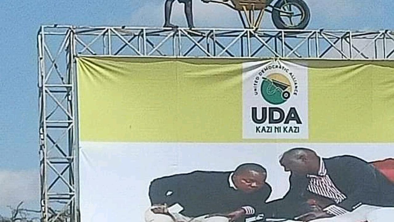 Photo Of A Man Touching Wheelbarrow Placed High On Top Of A Billboard Elicit Reactions Online