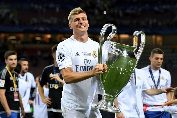 MILAN, ITALY - MAY 28:  Toni Kroos of Real Madrid  shows the trophy after winning the UEFA Champions League Final match between Real Madrid and Club Atletico de Madrid at Stadio Giuseppe Meazza on May 28, 2016 in Milan, Italy.  (Photo by Matthias Hangst/Getty Images)