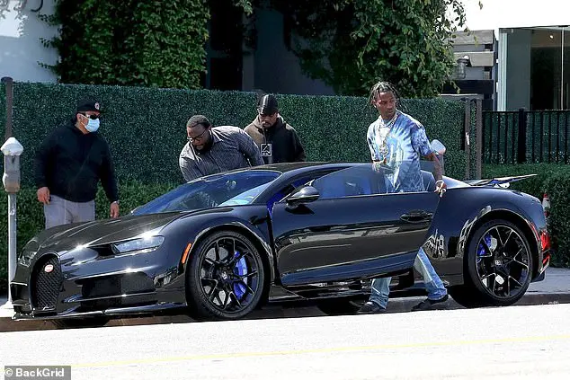 Treat yourself: Travis Scott celebrated his birthday in style by getting behind the wheel of a brand new Bugatti