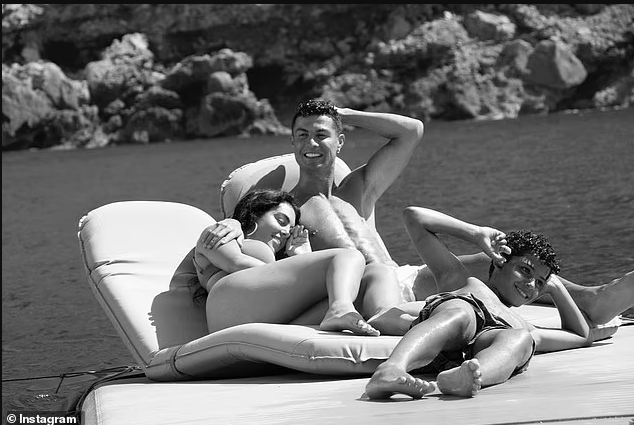 Shirtless Cristiano Ronaldo relaxes in the sun with girlfriend Georgina Rodriguez and his children during boat trip in Majorca (photos)