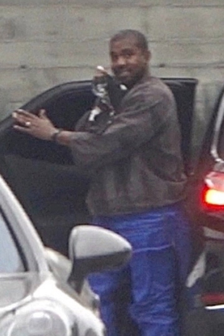 Kanye West all smiles as he?s pictured still wearing his wedding ring after Kim Kardashian filed for divorce (photos)