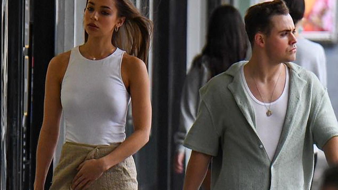 Rugging up! Aussie Stranger Things actor Dacre Montgomery's model girlfriend Liv Pollock almost has a wardrobe malfunction as she wears a blanket-style skirt to dinner in Sydney