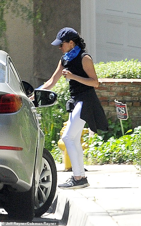 Meghan is seen out and about in Los Angeles for the first time with her husband since the couple moved there last month
