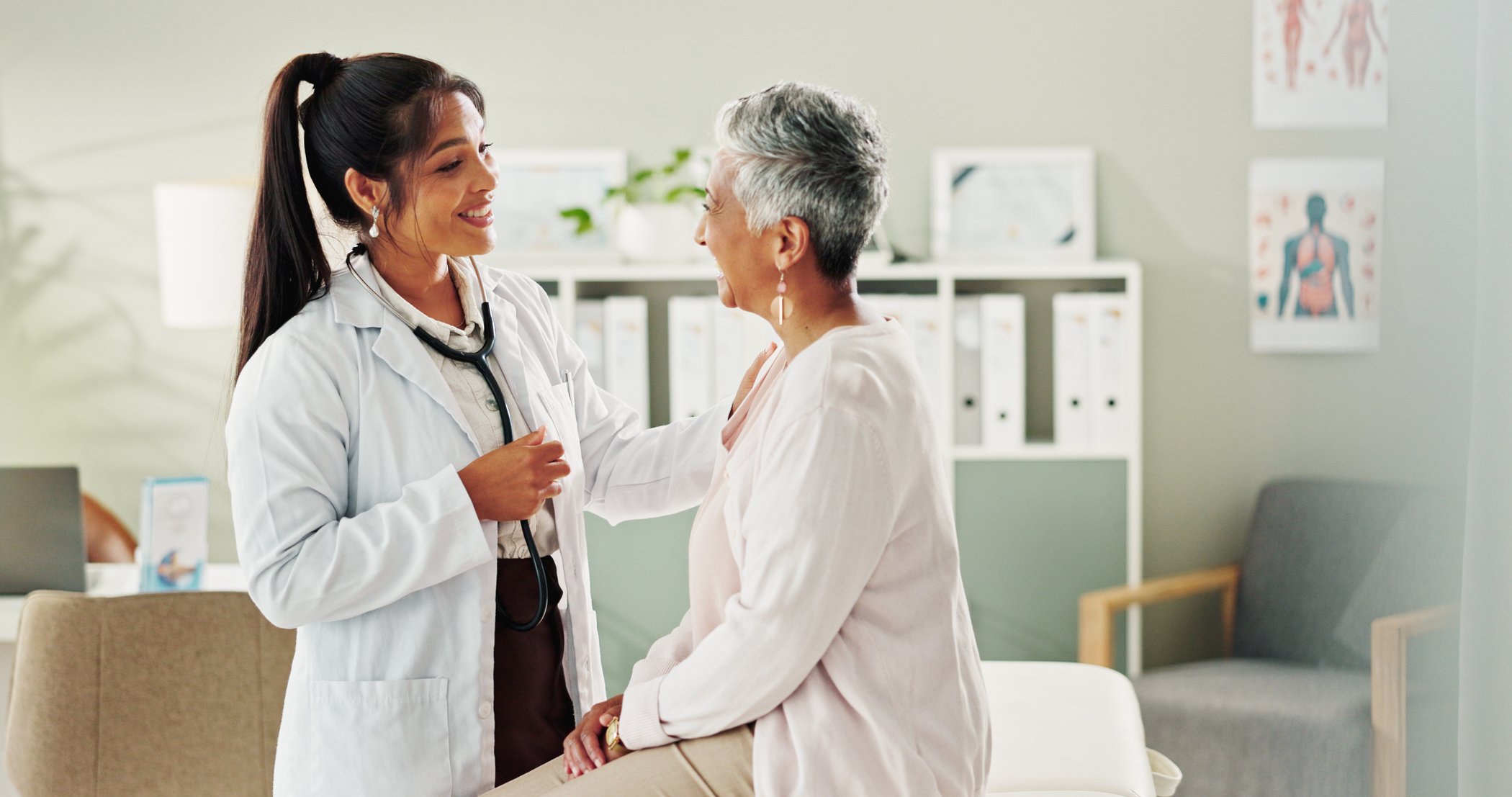 Woman, doctor and mature patient for consulting, support or conversation with checkup appointment in office. Female person, medical professional and healthcare talk for senior customer at clinic