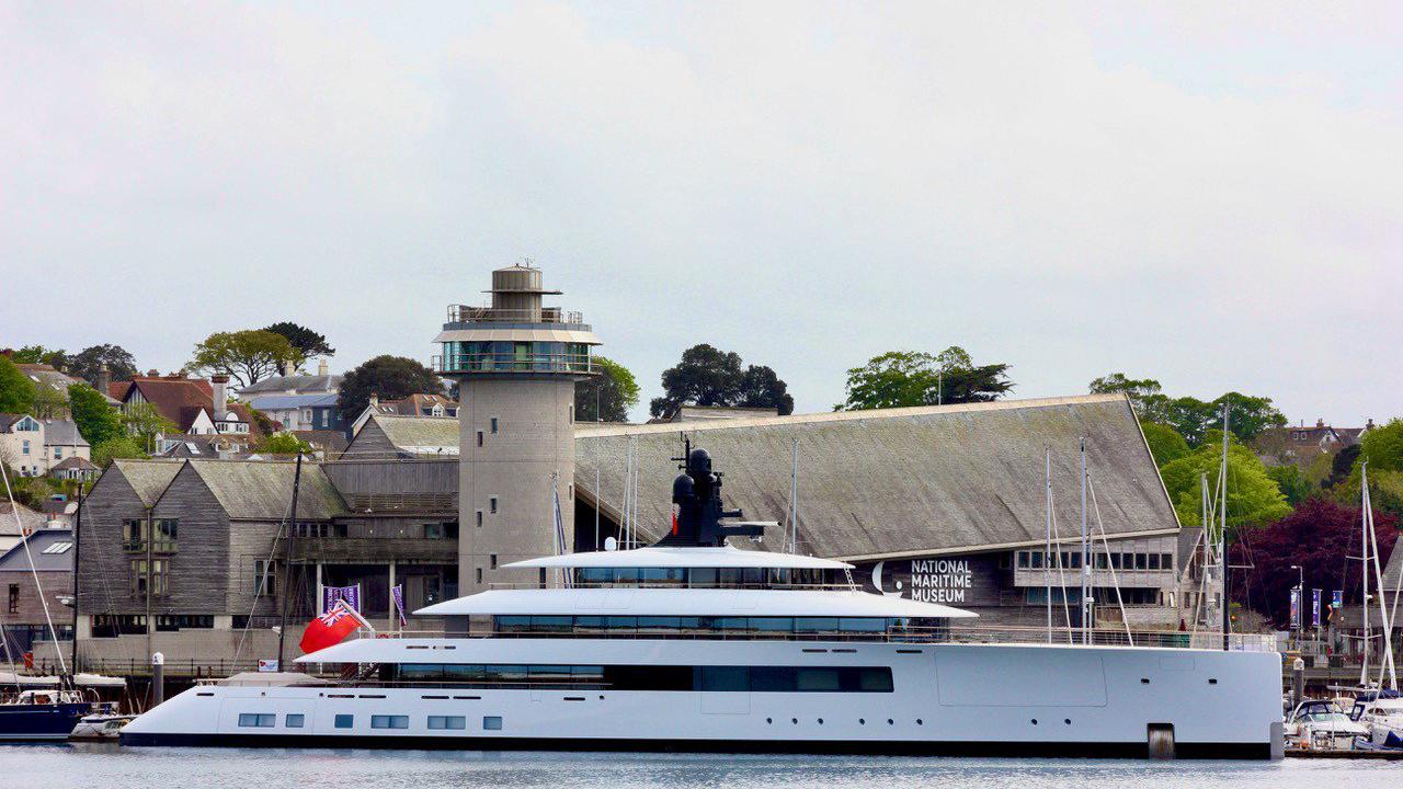 Who owns super yachts now in Falmouth alongside Howard Schultz's Pi