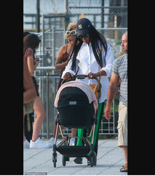 Supermodel Naomi Campbell, 50, is seen in public with her newborn daughter for first time (photos)