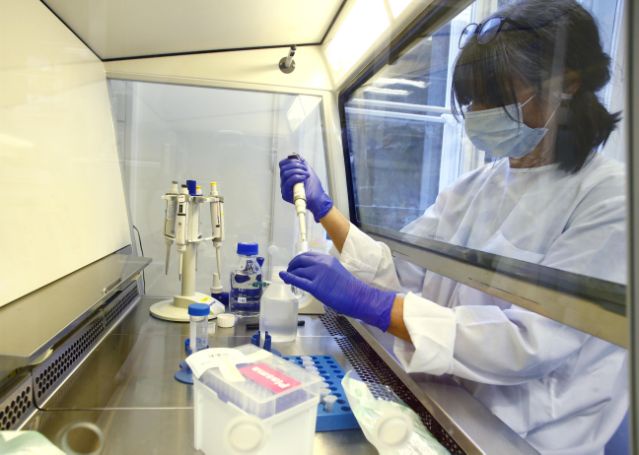 A laboratory technician is seen at the Inselspital Universitaetsspital Bern university hospital during researches for a vaccine against the coronavirus disease (COVID-19) in Bern, Switzerland April 22, 2020. (Arnd Wiegmann/Reuters)