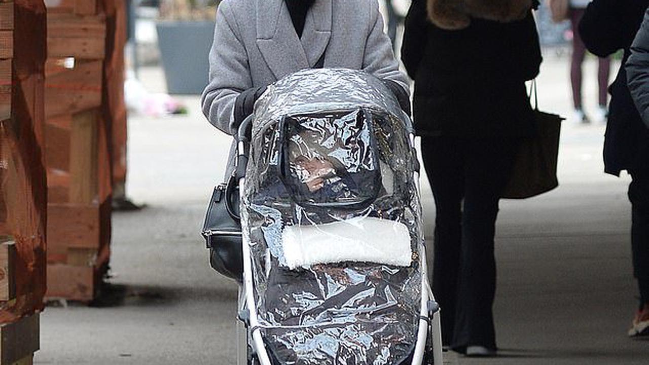 Lea Michele steps out with husband Zandy Reich and their infant Ever while bundled up against the cold in New York City