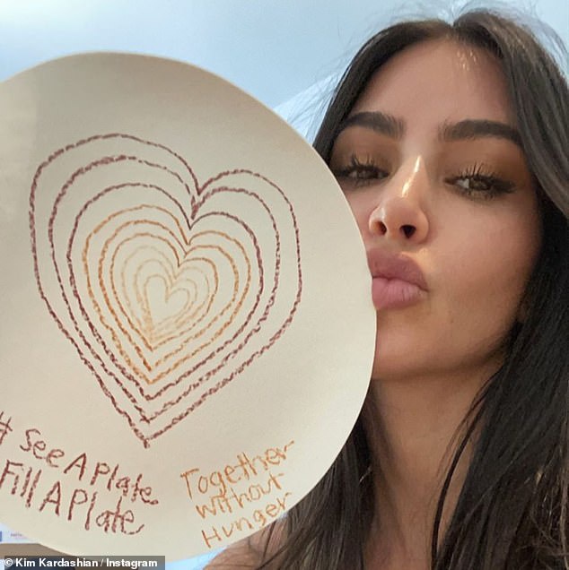 Talented family: She then posted some selfies with the colorful products of her children's creative minds