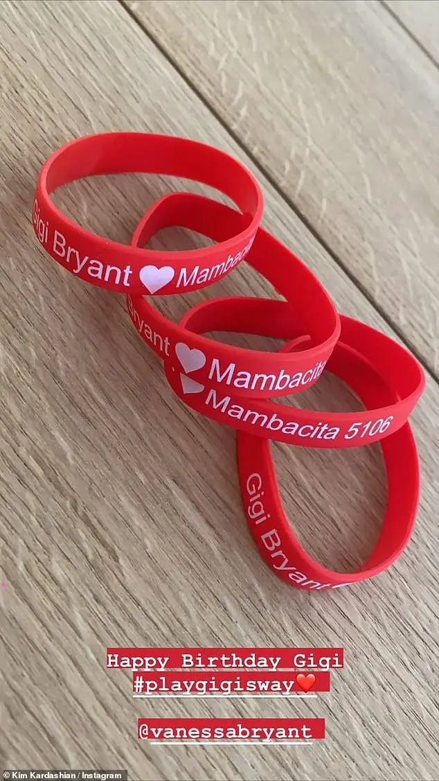 Honoring her: The Keeping Up With the Kardashians star posted a selfie on her Instagram stories wearing four of the red bracelets that said 'Gigi Bryant Mambacita'