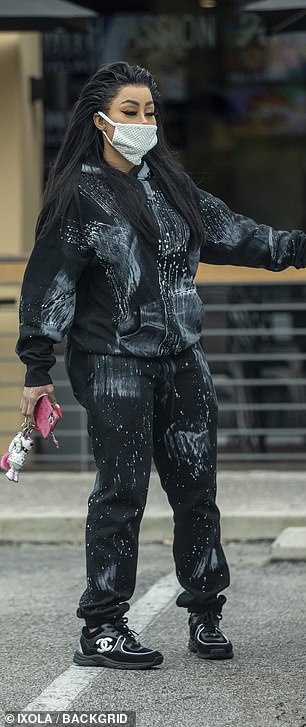 Her brunette tresses pulled away from her face