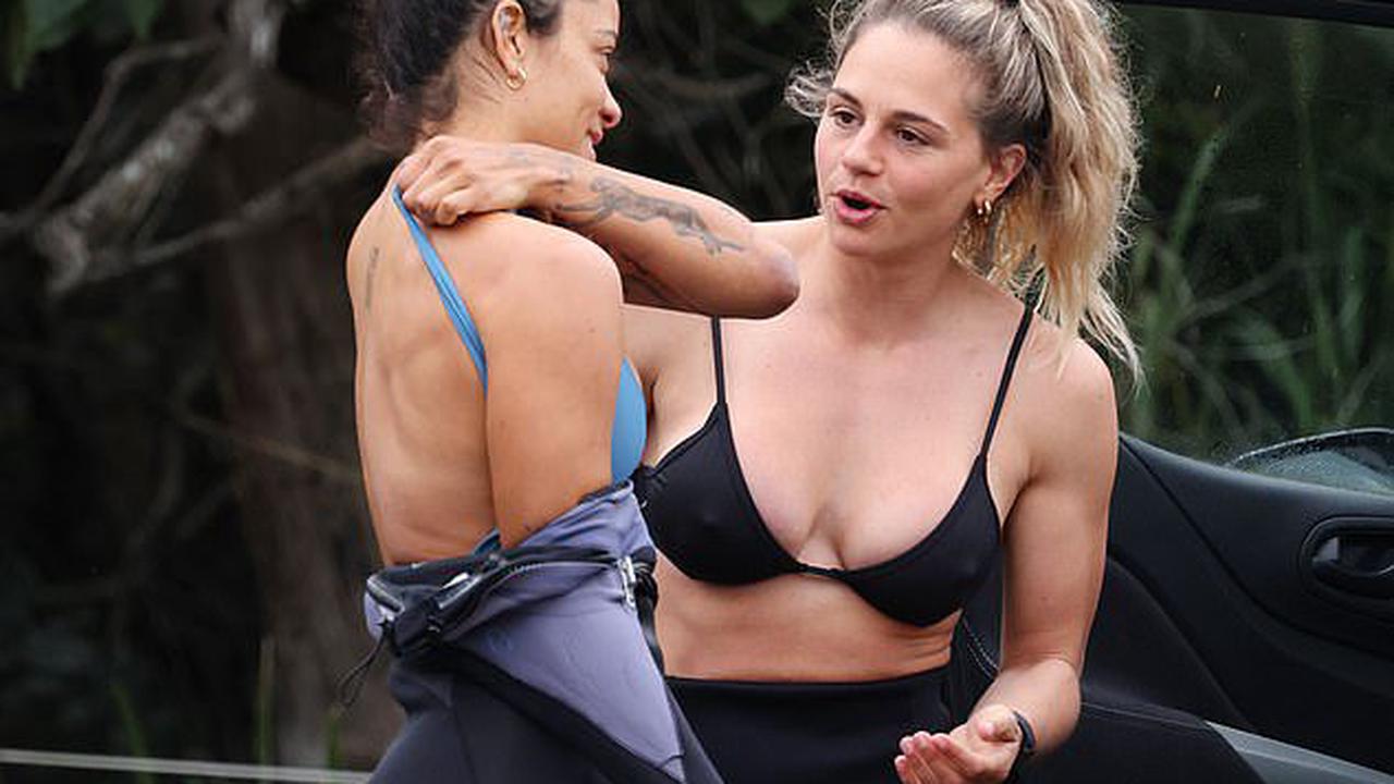 Australian Survivor star Shayelle Lajoie flaunts her ripped physique as she peels off her wetsuit after going surfing on the Sunshine Coast
