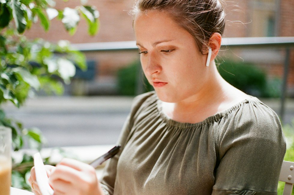 woman writing on paper