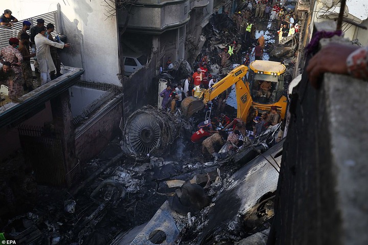 Pakistan plane crash: Two people pulled out alive from wreck of Airbus A320 that crashed in Karachi after