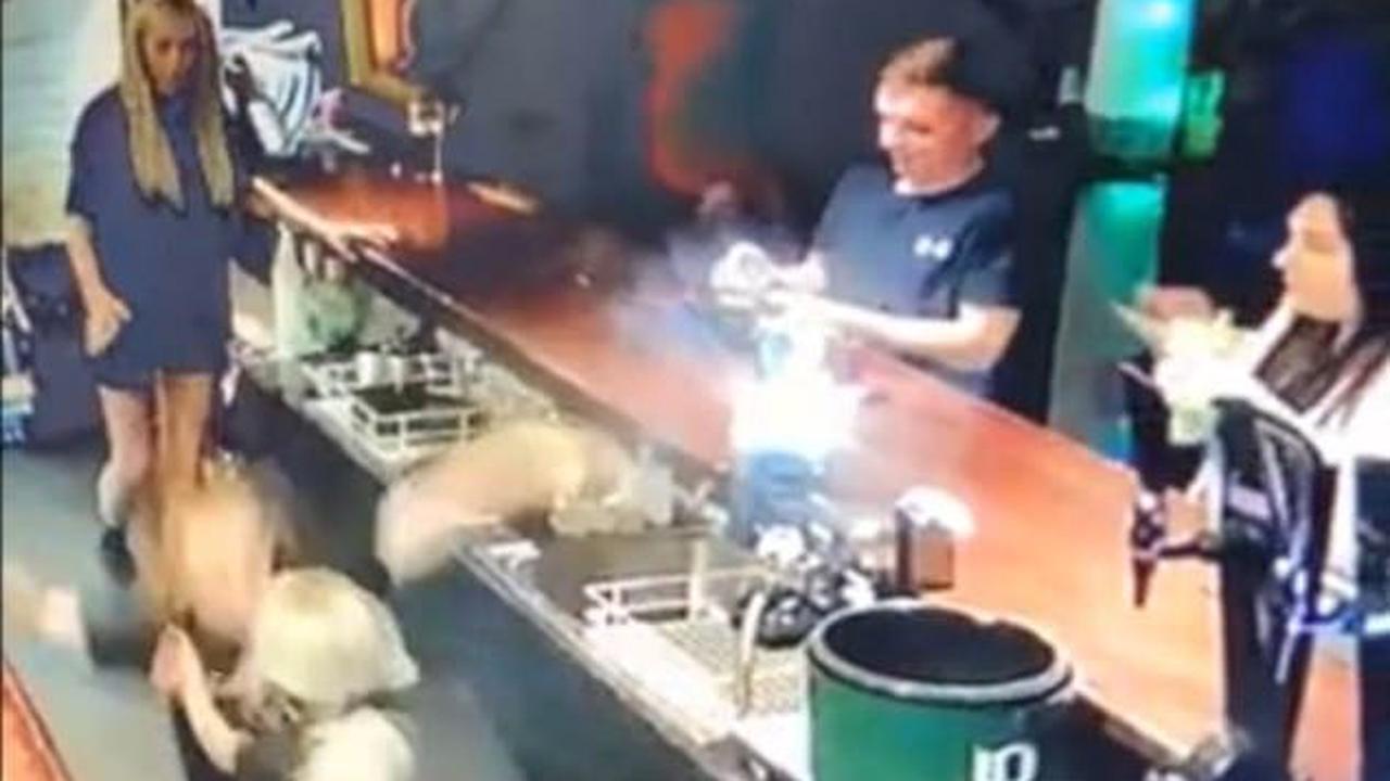 Shocking moment barmaid plummets down an open cellar hatch fracturing two ribs and injuring her knee