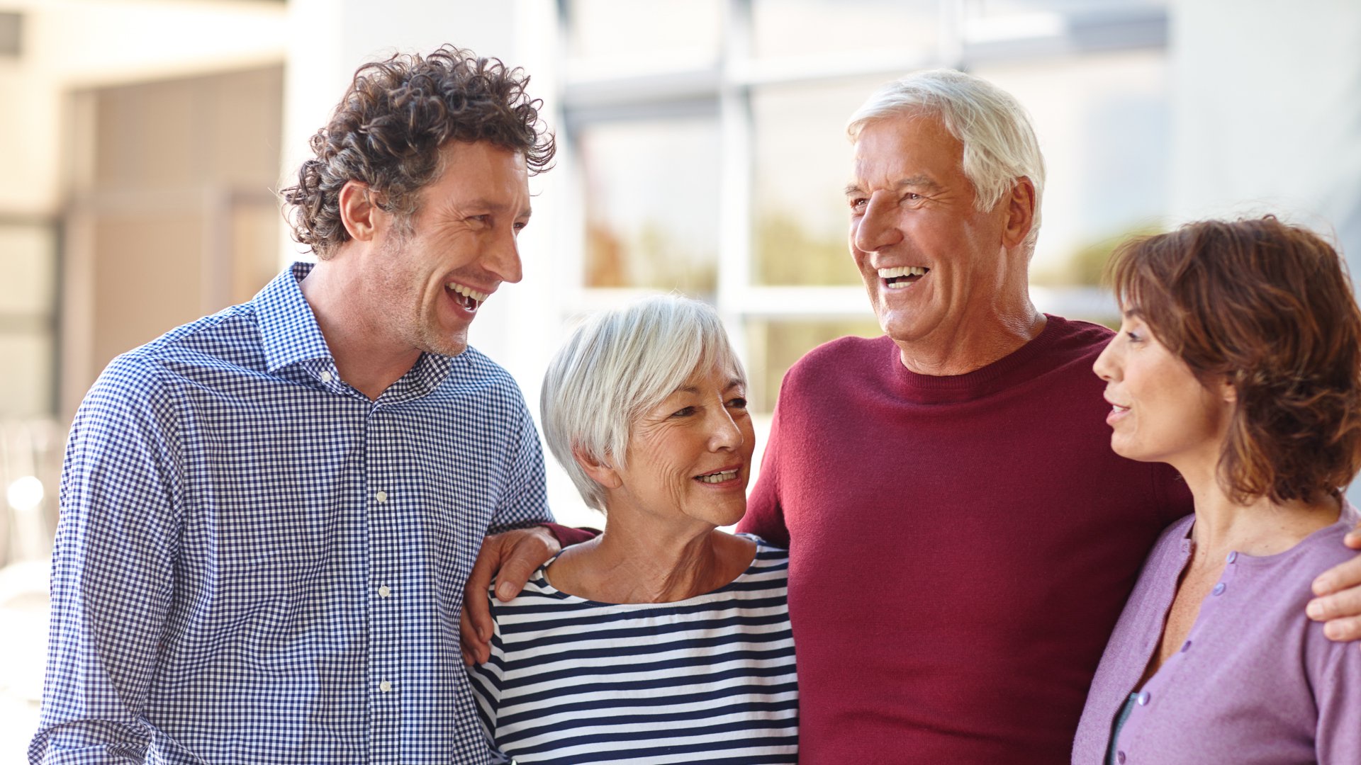 Discover a happy family standing together to illustrate successful estate planning and generational wealth.