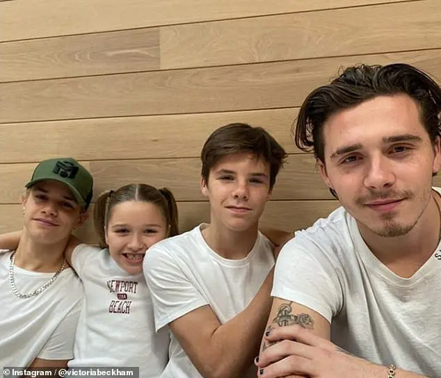 Family: Victoria Beckham shared a snap of her children Brooklyn, 20, Romeo, 17, Cruz, 14, and Harper, eight, all wearing white t-shirts while the brood enjoyed time together in LA