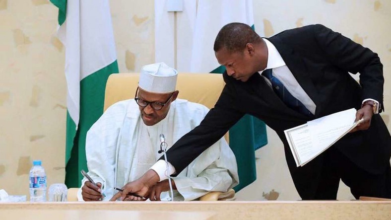 President Muhammadu Buhari (Left) and the Attorney General, Abubakar Malami (Right)