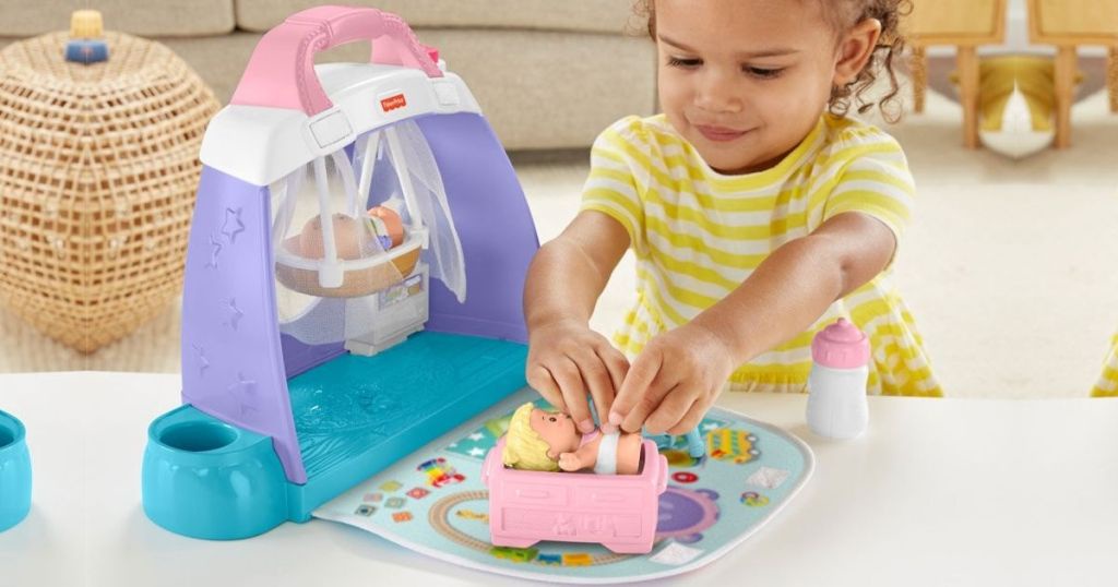 little people cuddle and play nursery