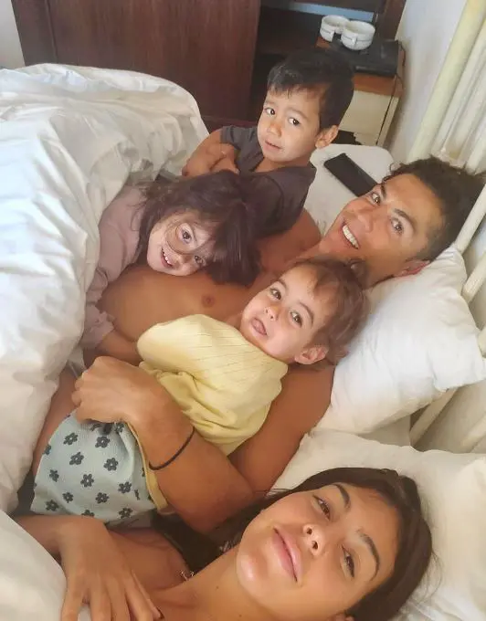  Cristiano Ronaldo shared a cosy family picture of him cuddling three of his children with Georgina Rodriguez