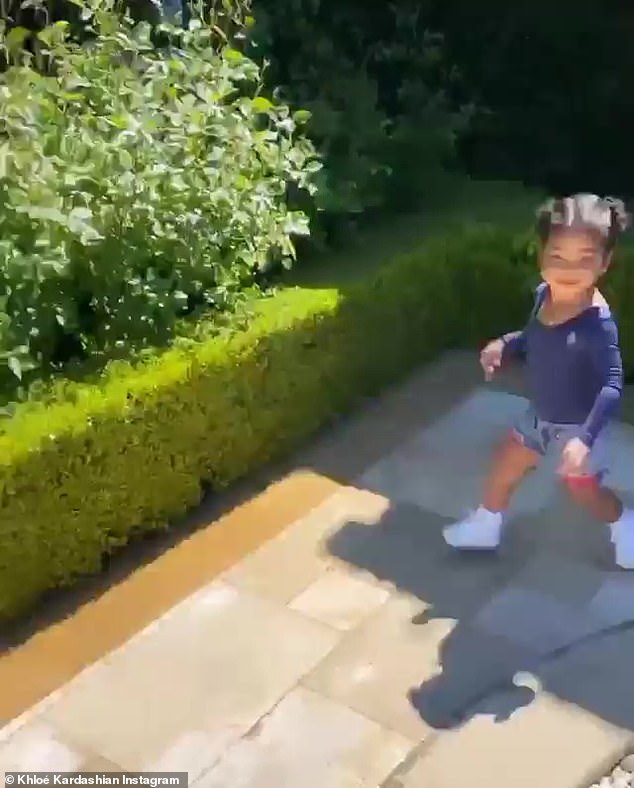 Active little one: True runs in circles as Khloe encourages her and then she pulls on the gate as if she wants to get in