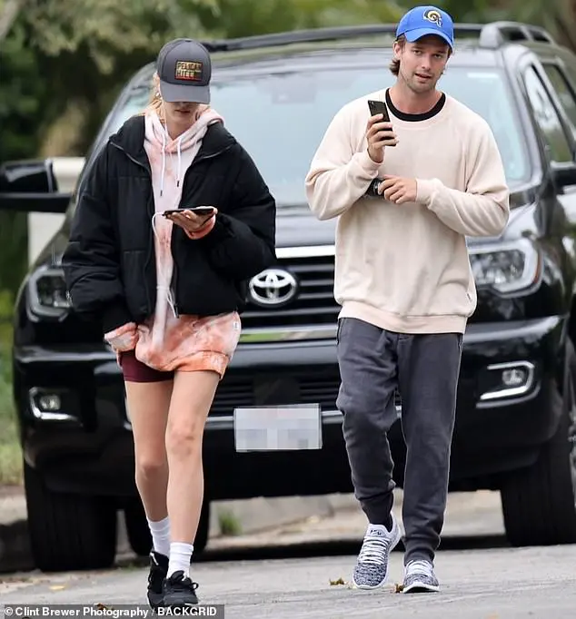 Quality time: Patrick Schwarzenegger emerged from lockdown for a Los Angeles stroll with his girlfriend Abby Champion on Wednesday