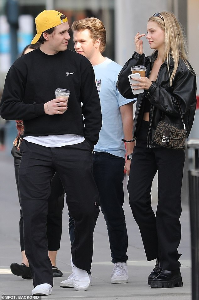 Love birds: Brooklyn Beckham stepped out with model Nicola Peltz in Beverly Hills on Wednesday afternoon to do some shopping and grab a cup of coffee