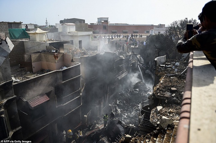 Pakistan plane crash: Two people pulled out alive from wreck of Airbus A320 that crashed in Karachi after