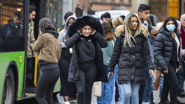 People board a local bus in central Uppsala,Sweden, Wednesday, Oct. 21, 2020. Uppsala, a university city north of Stockholm, on Tuesday became the first place in Sweden to introduce local restrictions as inhabitants were urged to avoid physical contact and parties and stay away from public transport. (Claudio Bresciani/TT News Agency via AP)