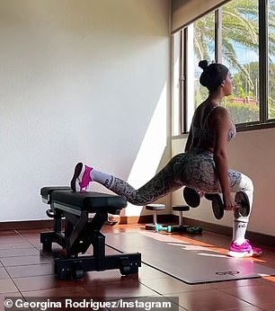 Relaxed: Georgina seemed to barely break a sweat as she exercised