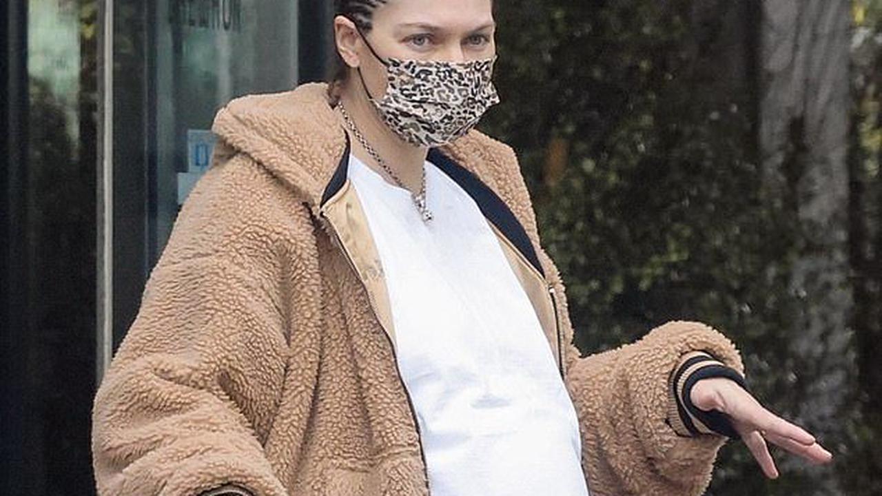 No fuss! Heavily pregnant Jessica Hart shows off her huge baby bump and braids her hair as she prepares to give birth to her second child
