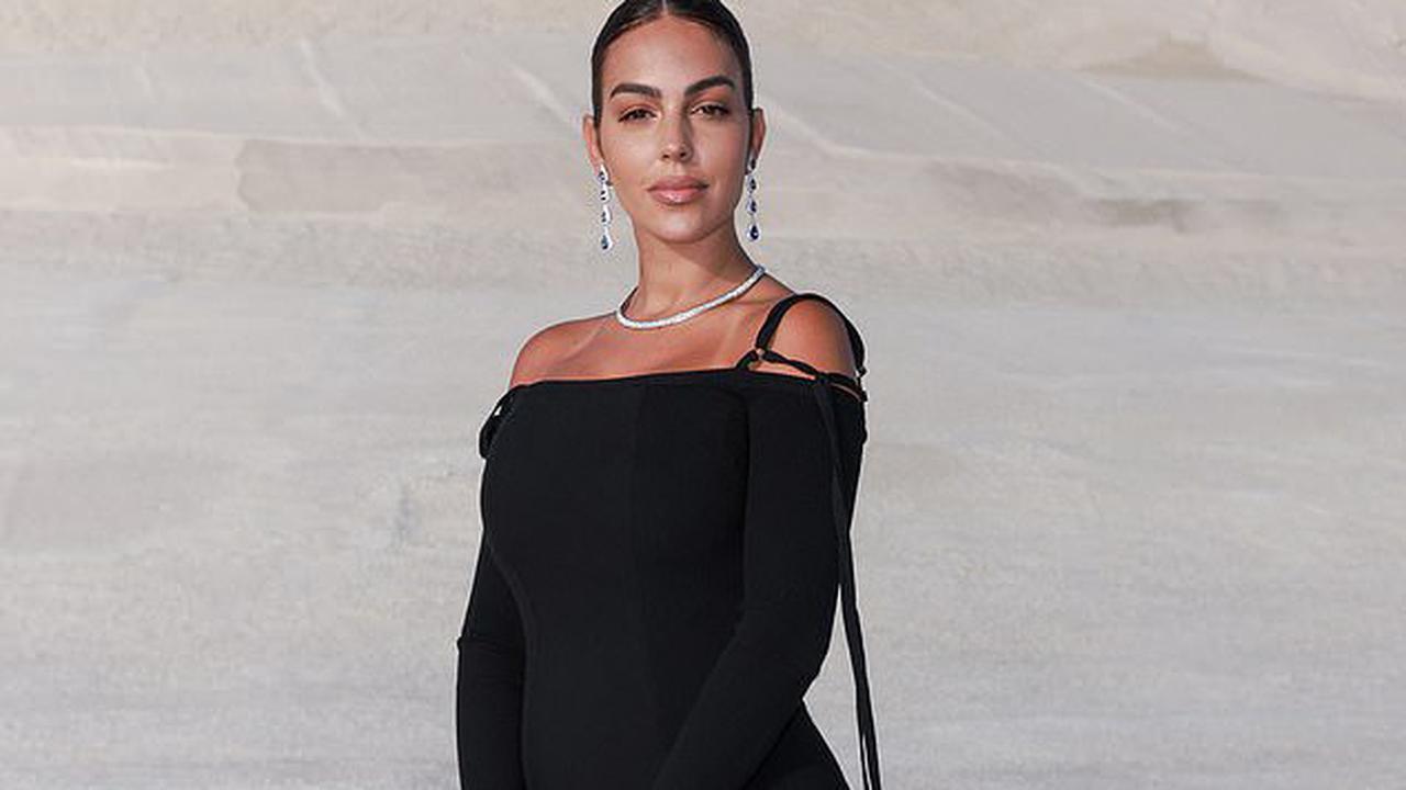 Georgina Rodriguez looks effortlessly chic in a figure-hugging black dress as she attends Simon Porte Jacquemus' fashion show on a French salt flat