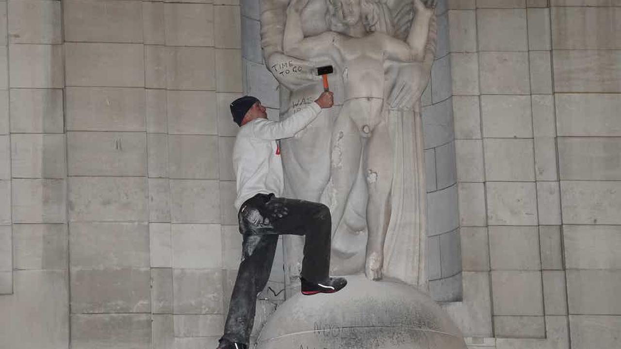 Man uses hammer on statue on BBC headquarters