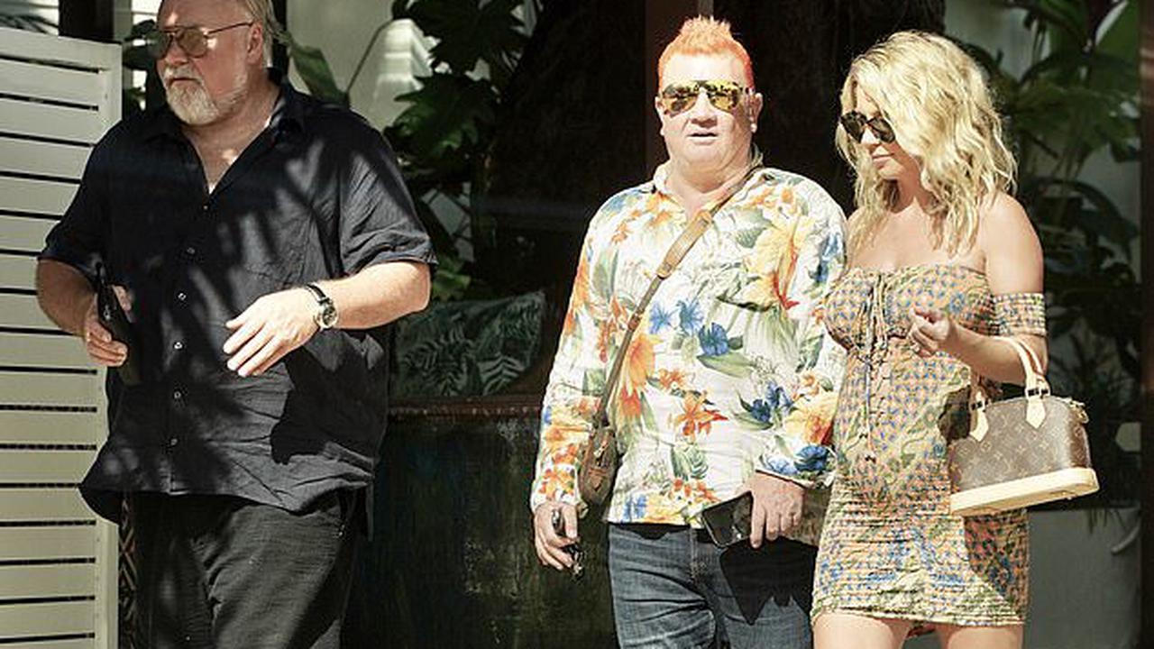 Kyle Sandilands' pregnant fiancée Tegan Kynaston flaunts her baby bump in a patterned minidress as the couple grab lunch with 'Mr Paparazzi' Darryn Lyons in Port Douglas