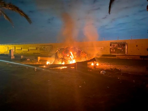 This photo released by the Iraqi Prime Minister Press Office shows a burning vehicle at the Baghdad International Airport following an airstrike in Baghdad, Iraq, early Friday, Jan. 3, 2020. The Pentagon said Thursday that the U.S. military has killed Gen. Qassem Soleimani, the head of Iran's elite Quds Force, at the direction of President Donald Trump. (Iraqi Prime Minister Press Office via AP)