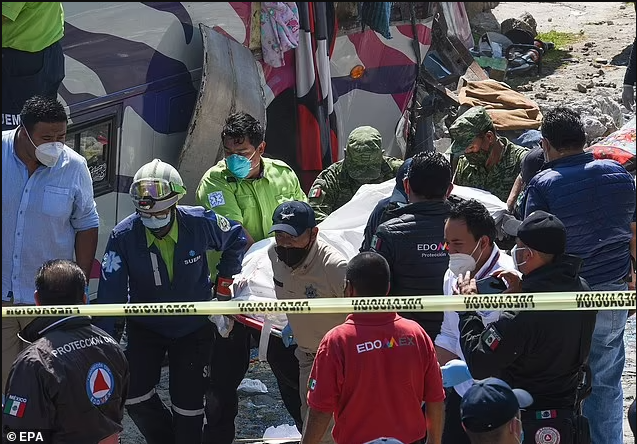 Nineteen people dead and 32 more injured after bus carrying Catholic pilgrims to religious site in Mexico crashed into a building (photos)