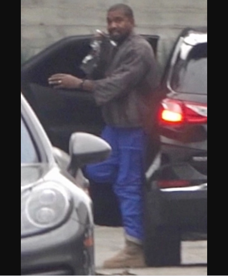 Kanye West all smiles as he?s pictured still wearing his wedding ring after Kim Kardashian filed for divorce (photos)