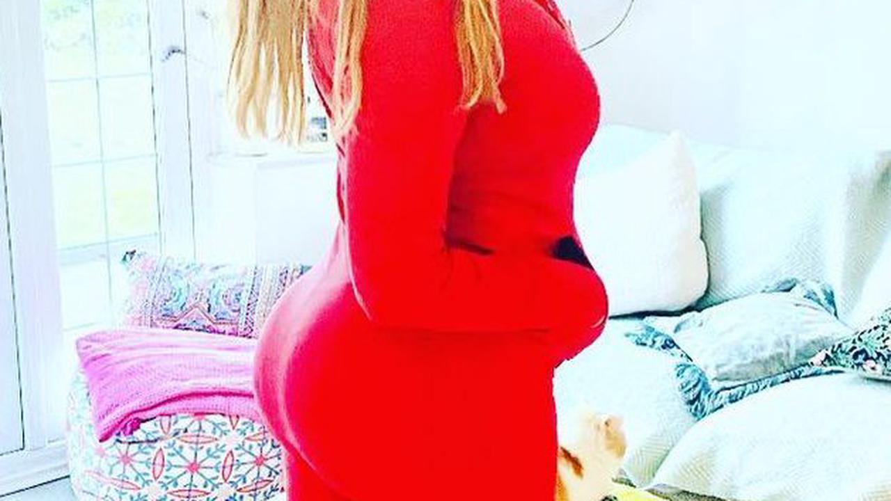 Carol Vorderman, 60, shows off her famous rear in skintight red jumpsuit